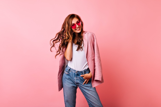 excited-white-girl-bright-stylish-glasses-posing-pink-dreamy-curly-woman-playing-with-her-ginger-hair-laughing_197531-11045
